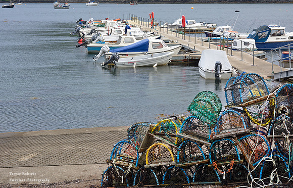 Plockton pier with fishing baskets