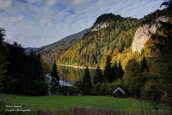 Sun catching the mountains behind the lake at Schwarzensee