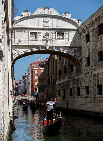 Gondolier telling the story of,...... The bridge of sighs