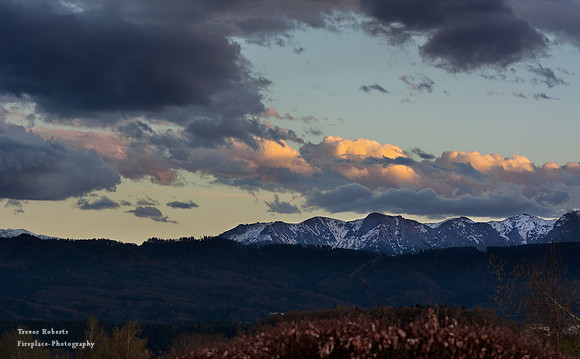 slight red glow  on the mountains at sunset . From our balcony