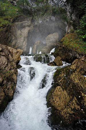 The source cave at Golling. The Schwarzbach river pours out of the mountain spring